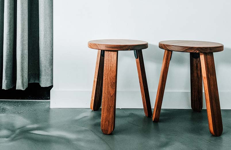 Two three-legged stools