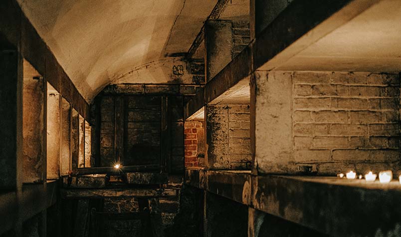 Dark room lit with scandles